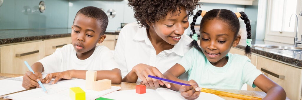 decorative image of mother with two children doing homework